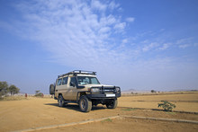Safari Transport In The Plain Of Serengeti, Tanzania