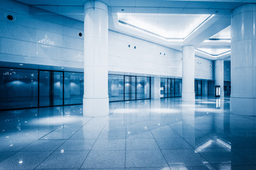 Sticker - empty building hall with marbled floor,blue toned.