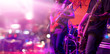 Guitarist and colorful lighting on stage, soft focus