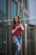© nagaets - Girl with sunglasses using mobile phone