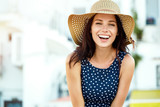 Fototapeta Młodzieżowe - Portrait of a beautiful woman in a straw hat. Laughing girl. Summer time