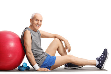 Sticker - Senior with a pilates ball and dumbbells