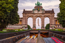 Dramatic View Of The Triumphal Arch And Belliard Tunnel In Park Cinquantenaire In Brussels During Sunset