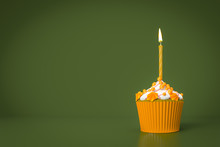 Orange Cupcake With A Candle
