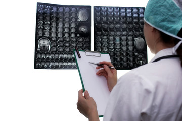 Wall Mural - Doctor holding a picture of a brain MRI