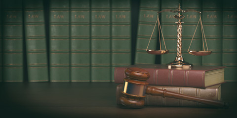 Gavel and scale on the background of vintage lawyer books. Concept of law and justice.