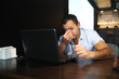© alexkich - Armenian handsome man working behind laptop