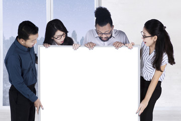 Wall Mural - Business team look at empty whiteboard