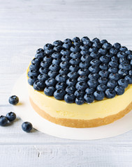 Creamy cheesecake with blueberry, vertical, top view, selective focus
