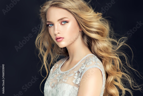 Blonde Fashion Girl With Long And Shiny Curly Hair Beautiful
