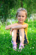 © Ivan Karpov - Little girl sitting in the grass