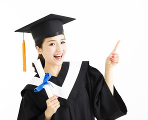 Happy  graduation showing diploma and pointing gesture