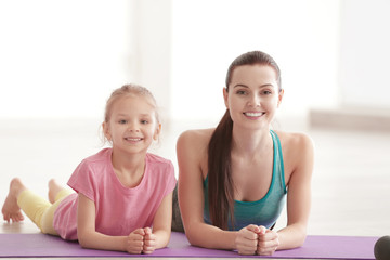 Poster - Mother and daughter lying on mat