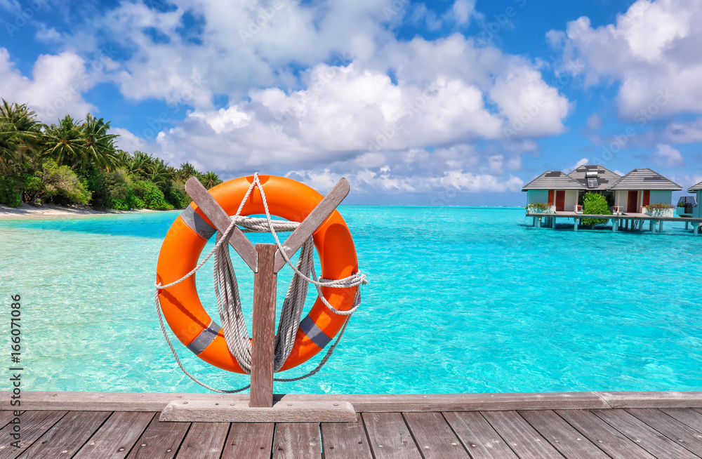 Wooden pontoon with flotation ring at tropical resort