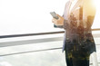 © somchaikhun - Asian business man used mobile in office, double exposure photography.