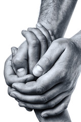 Wall Mural - Concept of salvation. Men's hands hold the female palm on isolated, white background.
