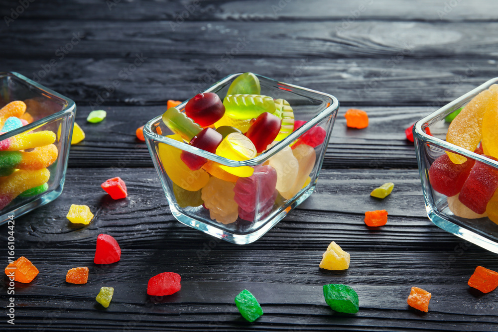 Composition with tasty candies on table