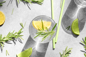 Sticker - Glass of fresh lemonade with rosemary on grey background