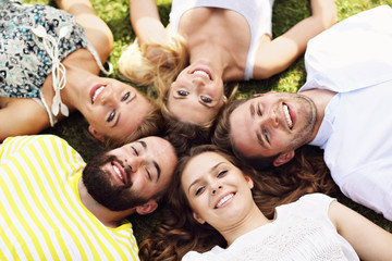 Wall Mural - Friends group having fun together on grass