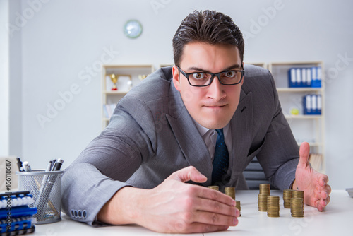 Fotografía Businessman with golden coins in business growth concept