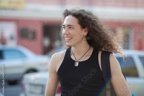 Handsome Man Smiling On The Street Long Curly Hair Man Buy