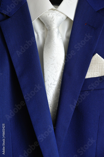 white tie white shirt blue suit