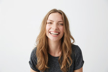 Young Cheerful Happy Girl Smiling Laughing Looking At Camera Over White Background.