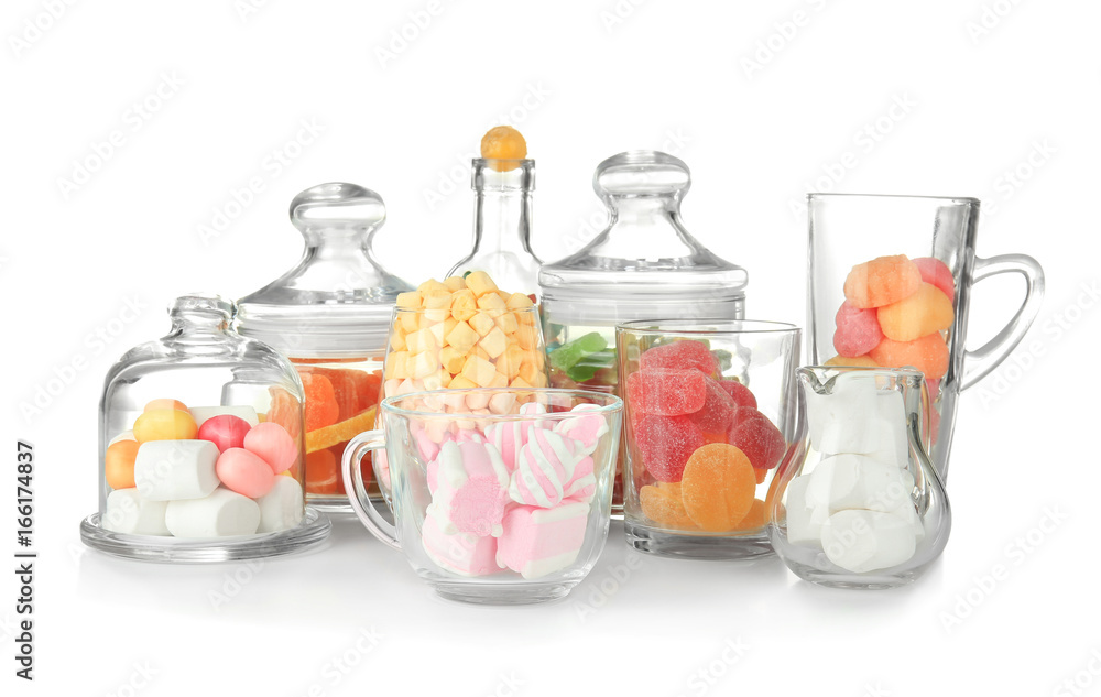 Colorful candies in glassware on white background
