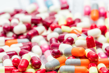 Wall Mural - Colorful of antibiotic capsules pills on white background, drug resistance