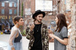 © shurkin_son - Candid shot of two beautiful stylish teenage girls having fight outdoors, trying to win love of handsome hipster guy who is standing between them and saying to calm down. Love triangle concept