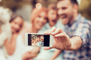 Wall Mural - Family taking picture of themselves