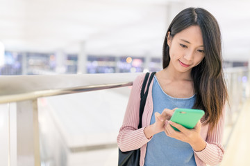 Canvas Print - Woman use of cellphone in airport