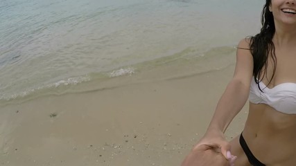 Sticker - Couple Spinning On Beach Holding Hands POV Action Camera View Of Young Girl Happy Smiling Turning Around Near Sea During Summer Vacation