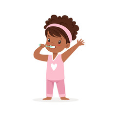 Canvas Print - Adorable black cartoon girl in a pink pajamas brushing her teeth, kids dental care vector Illustration