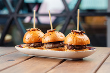 Small Burgers Served On One Plate As Appetizers And Decorated With Truffles