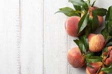 Fresh Peaches Fruits With Leaves On Wooden Background, Top View