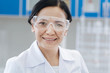© zinkevych - Happy female scientist wearing protective glasses