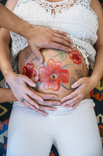 Pregnant Belly Mandala Painting By An Artist On Young Woman Belly From Above