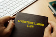 Book with title overtime labor law.