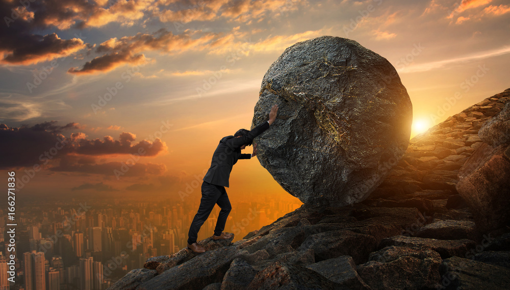 Business man pushing large stone up to hill , Business heavy tasks and problems concept. - obrazy, fototapety, plakaty 
