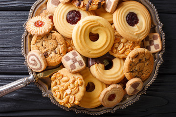 Wall Mural - Festive cookie mix close-up on a plate. horizontal view from above