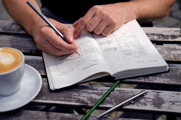 Wall Mural - man draws a sketch graphic design for website