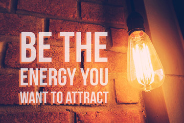 Inspirational and motivation quote on blurred light bulb background with vintage filter