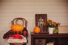 Fall At Country House. Seasonal Rustic Decorations With Cozy Blankets And Flowers On Wooden Background On Chair