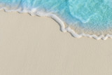 Soft waves of blue sea on the Maldives beach for the background.