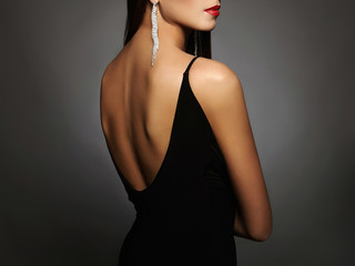 Wall Mural - woman in a black sexy dress and jewelry