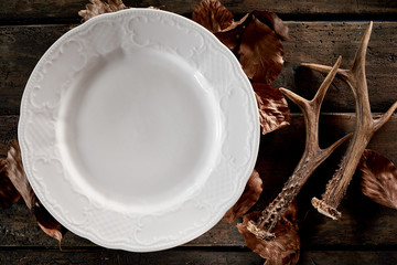 Wall Mural - seasonal empty plate, antlers and autumn leaves
