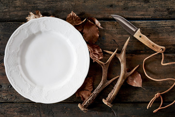 Wall Mural - seasonal hunting knife, antlers and autumn leaves