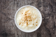 Arroz Con Leche. Rice Pudding With Cinnamon On Wooden Background

