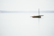 Lonely Boat On Calm Sea